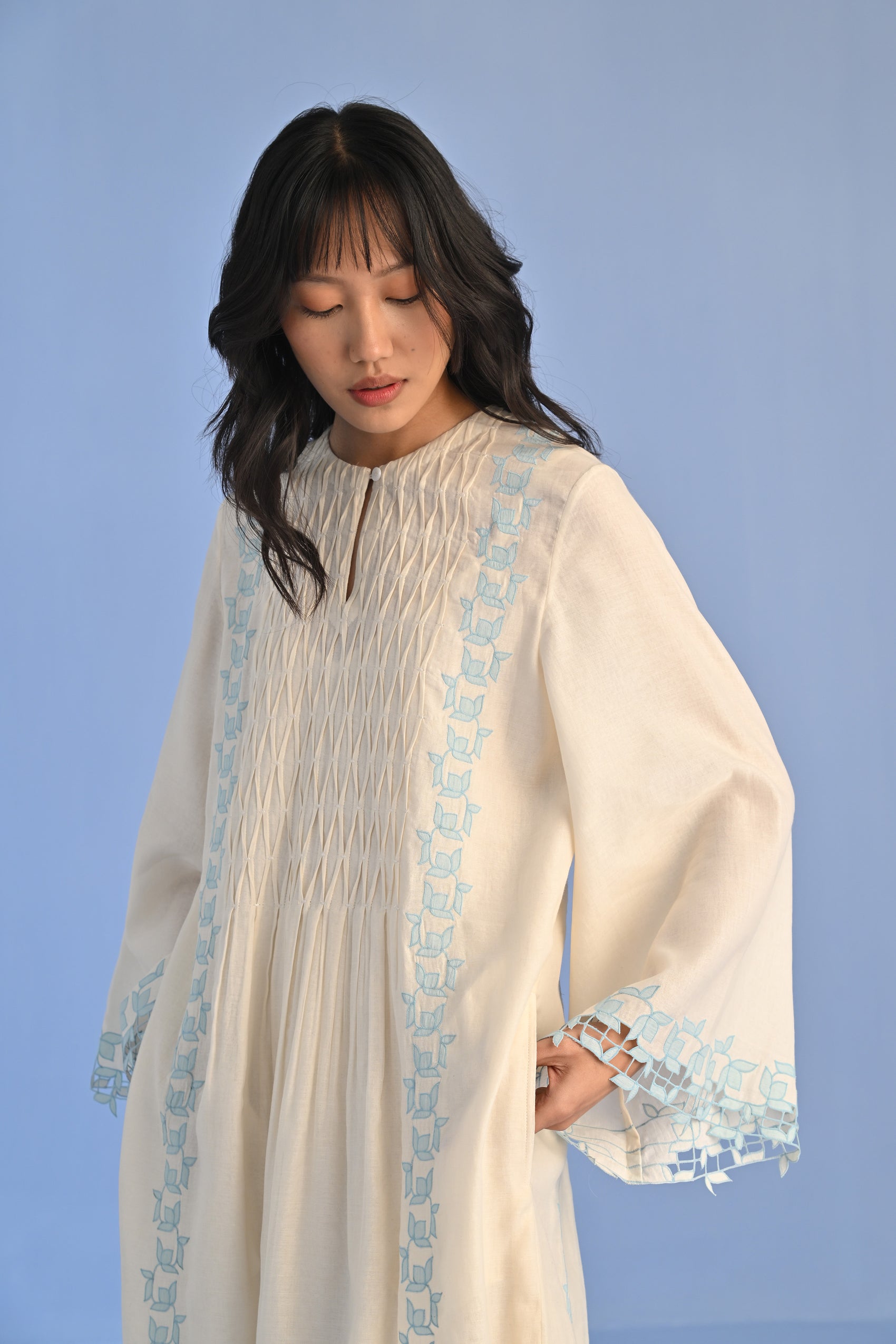 PLEATED DRESS WITH CUTWORK