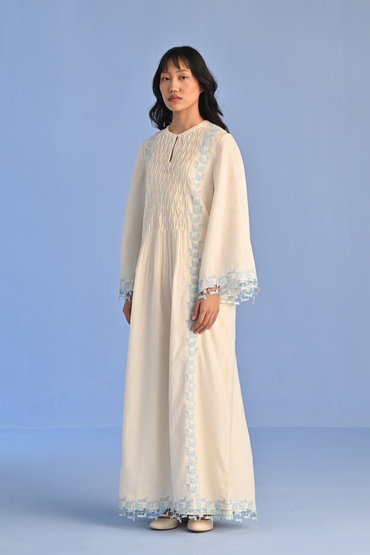 PLEATED DRESS WITH CUTWORK